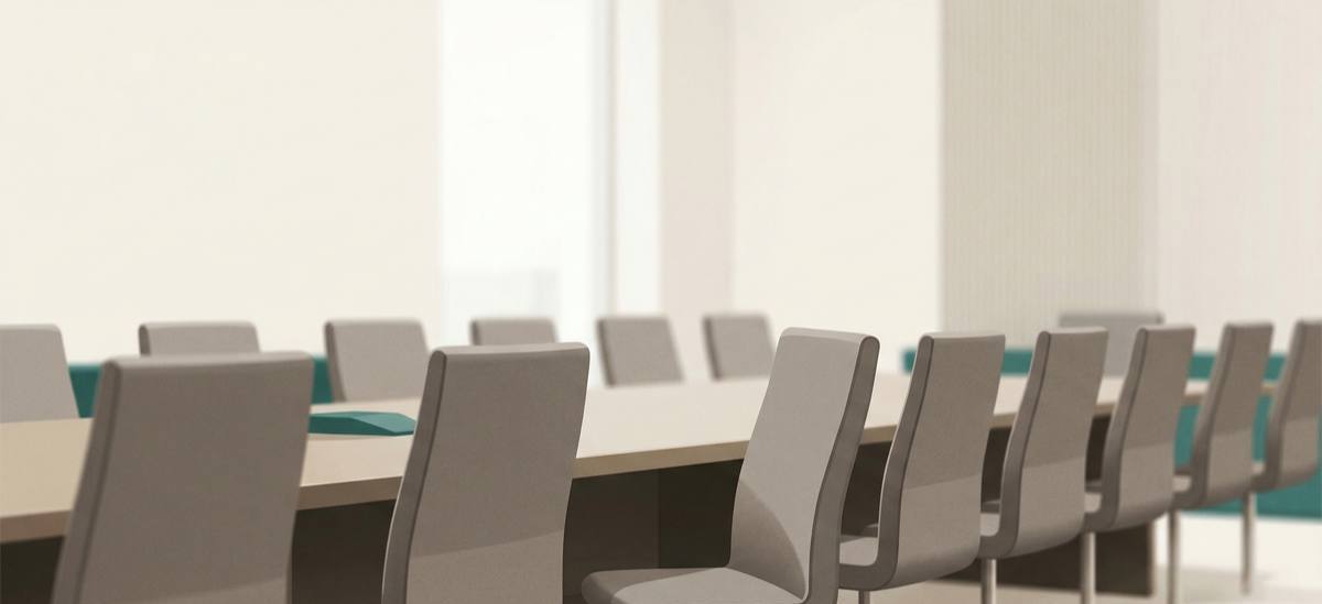 Stressed worker surrounded by back-to-back meeting notifications, illustrating the toll of workplace meeting overload
